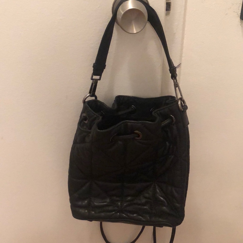 Milly black quilted string backpack handbag